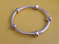CC SKYE Love Me Knot Gold Tone Bangle Bracelet