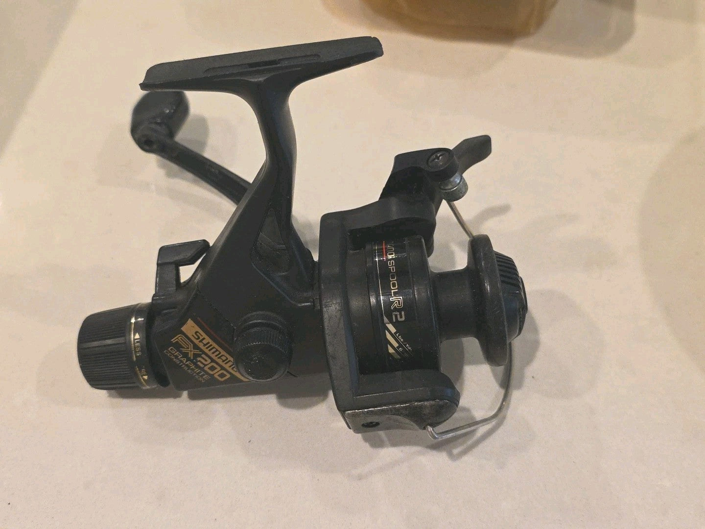 Fishing SHIMANO FX200 Graphite Spinning Reel with Rear Drag & Quickfire II ￼ Nic