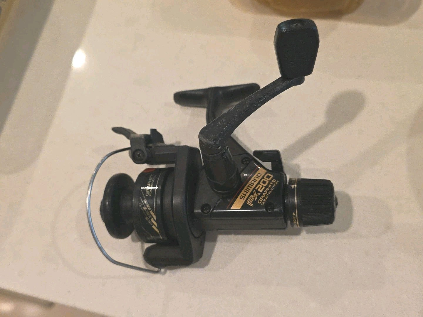 Fishing SHIMANO FX200 Graphite Spinning Reel with Rear Drag & Quickfire II ￼ Nic