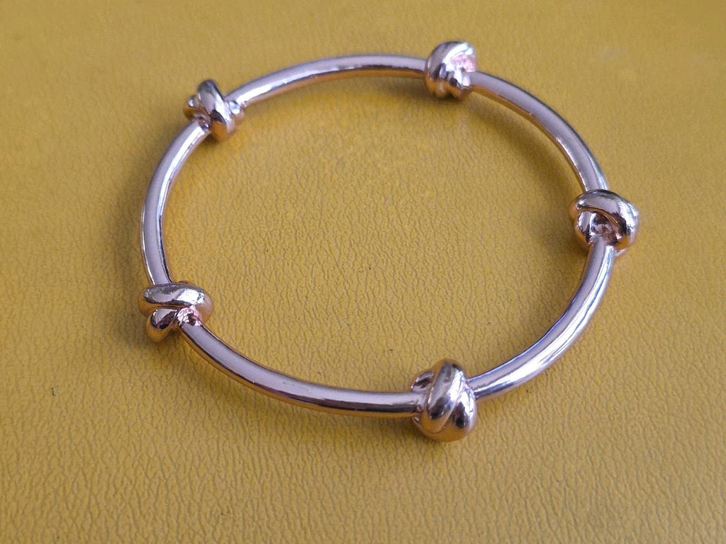 CC SKYE Love Me Knot Gold Tone Bangle Bracelet