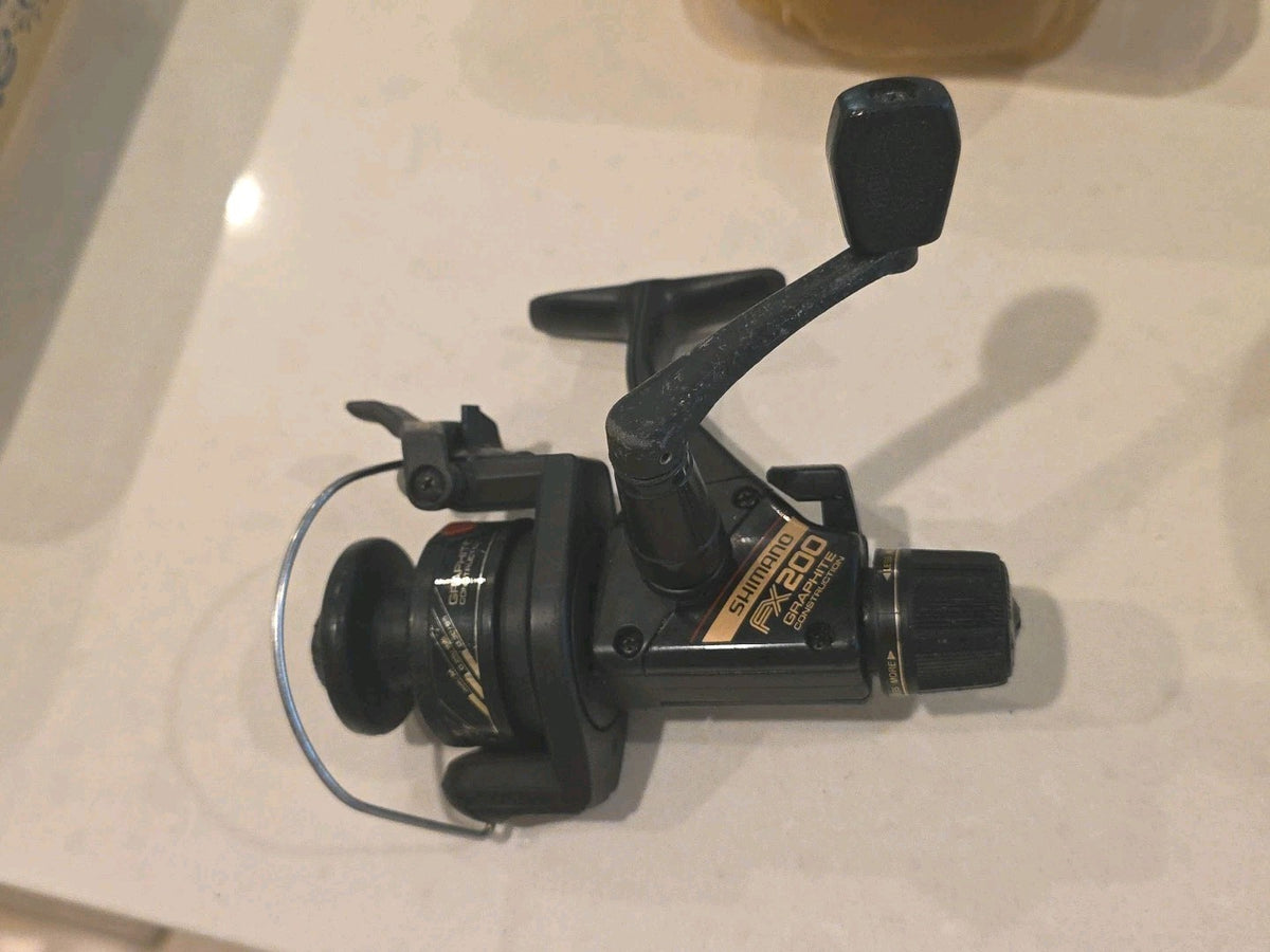 Fishing SHIMANO FX200 Graphite Spinning Reel with Rear Drag & Quickfire II ￼ Nic